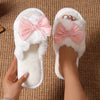 White Slippers with a Bow Design